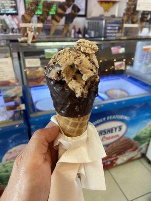 Cappuccino ice cream in a chocolate waffle cone.