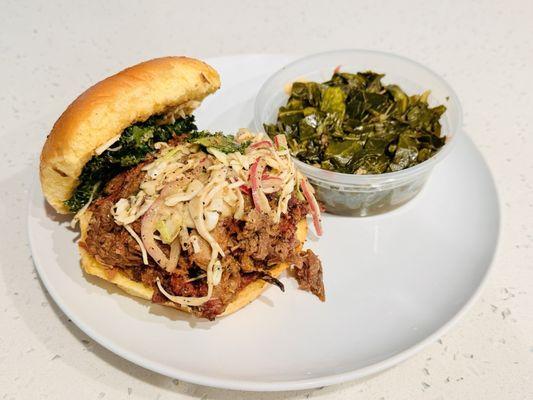 Brisket sandwich with collard greens. Sandwich is topped with their amazing slaw and kale... so yummy!