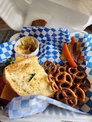 Mountain Box: half a turkey sandwich, pretzels, carrot sticks, hummus, bonus cookie.