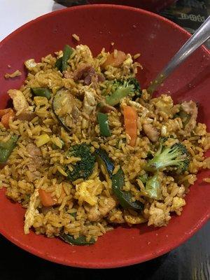 Fried rice bowl with veggies and bacon shrimp and chicken