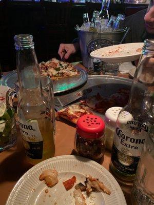 Crushed pizza and beers