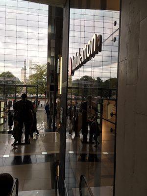 Down escalator looking towards Columbus Circle. Lululemon on the right.