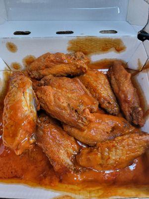 Dry wings laying in the sauce