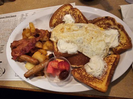 Two sausage to bacon home fries fruit eggs pancakes and French toast