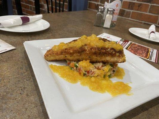 Crusted salmon over a vegetable rice drizzled with a apricot sauce