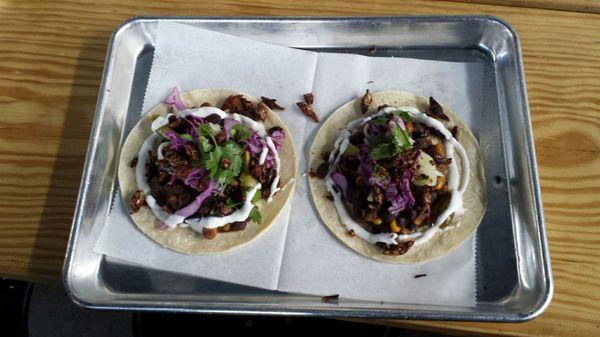 Beef Belly Taco, Seasonal Veggie Taco both topped with crickets