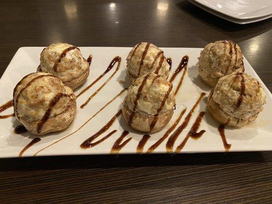 Stuffed mushrooms with sausage, cream cheese and a balsamic reduction.