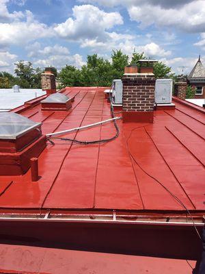 Old metal roof after it was cleaned , scraped,repaired and painted with Cal-Bar metal roof paint