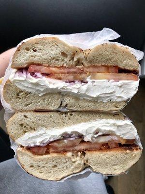 Everything bagel with cream cheese, onions and tomato