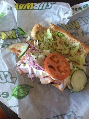 What the heck is this crap, lady threw my sandwich together like it was a salad. bs.