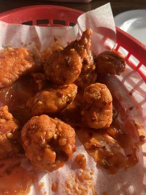 What's left of 25 hot boneless wings. These are soooooo good! Great tasting sauce! Makes ya sweat but not so hot you are miserable.