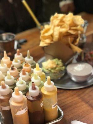 A variety of delicious sauces for your meal. Tortilla chips, guacamole, and pico de gallo were great!