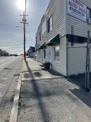 Approaching the storefront from 4th Street