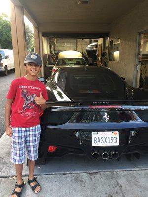 My son with a Ferrari 458 Italia