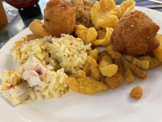 Fried fish, seafood rice, hush puppies, and calamari.