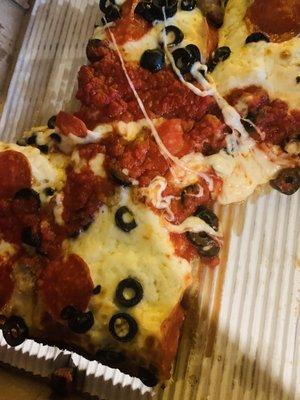 Pizza with olives and pepperoni