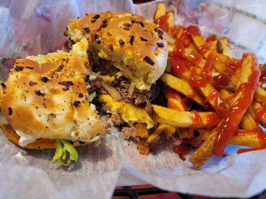 Build your own 1/2 lb burger on onion roll with fries I requested mayo, mustard, ketchup, onion, lettuce and white cheddar cheese.