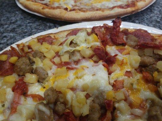 Large pepperoni with sausage, pineapple, artichoke hearts, and sun dried tomatoes! Yumm!