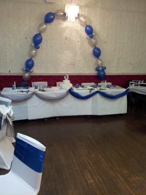 The back room all set up for a wedding party.