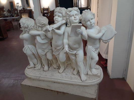 Cherubs, reading music.