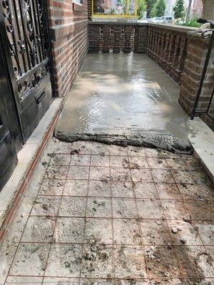 Front entrance cement / concrete work to prevent water intrusion into the basement