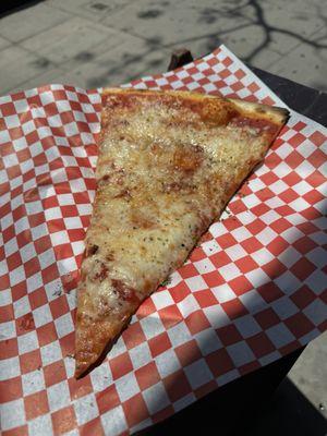 Thin cheese pizza slice