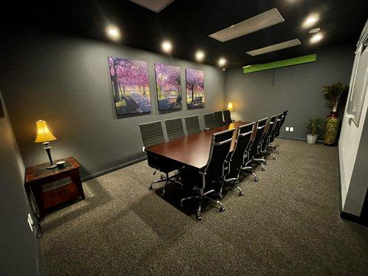 Our Boardroom provides seating for 14-16. Apple TV, Chrome Cast, Whiteboard, Green Screen, White and Black Screen.