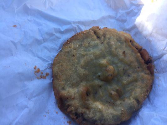 Looks like a Cookie but it's not. It's a hamburger patty with cheese, battered and deep fried