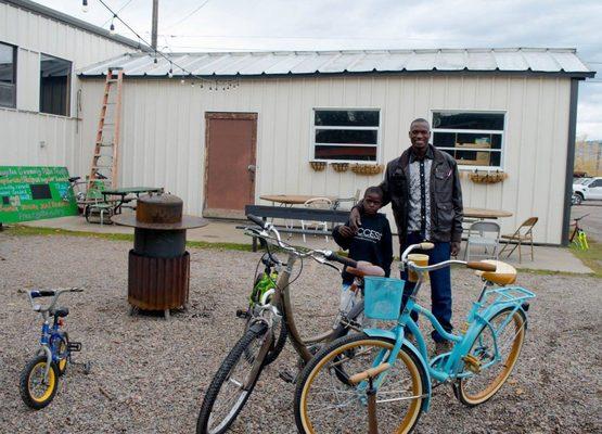 Father and son with their freshly tuned up and fixed bicycles! We strive to find each bicycle donated to us a good home.