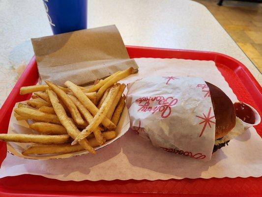 Overcooked burger and warm fries.