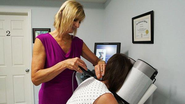 Dr. Susan Cunico using the sigma method for a chiropractic adjustment.