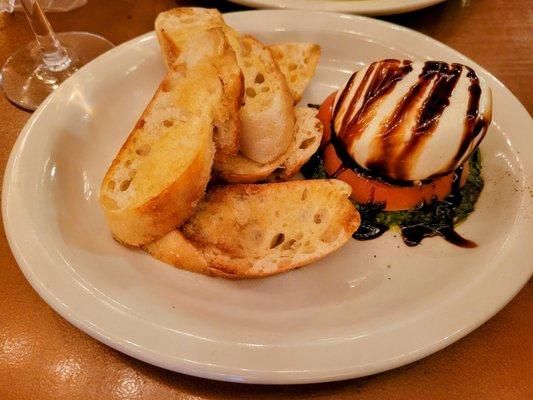 Mozzarella Burrata,
 creamy and delicious, on a bed of pesto!!!