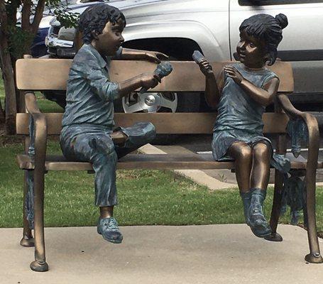 Ice cream eating Timmy and Cindy are statue characters around Owasso. A statue is in front of the Candlewood.