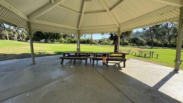 Gazebo with picnic tables you can move around (aka not bolted into the cement)  7 electrical outlets available