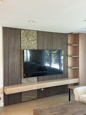 Tv entertainment area. Decorative wall panels and custom floating tv stand