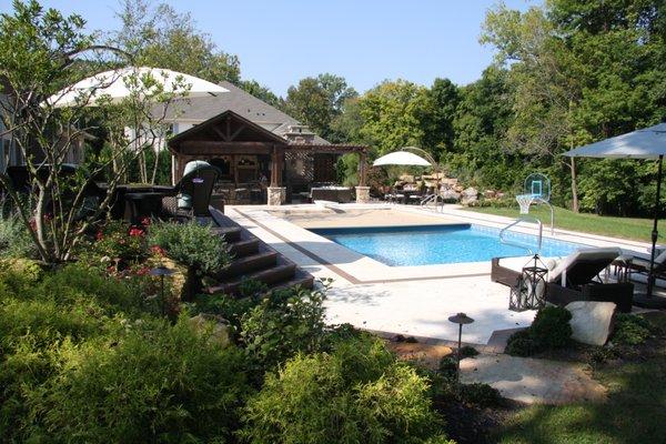 Outdoor living space with Covered Kitchen, Fireplace Pool, Azek Deck,  Spa and Water feature