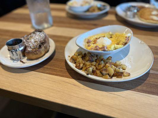 Delicious hot egg scramble with seasoned potatoes and a cinnamon French toast.