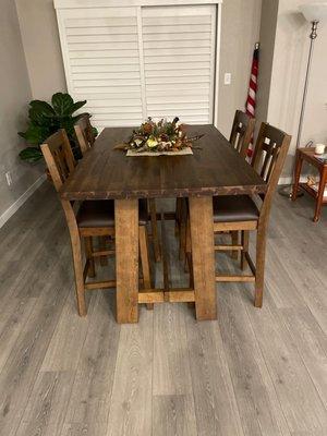 Bar height table with four chairs