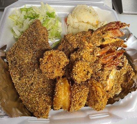 Fried Red Snapper, shrimp, lobster tail with smother potatoes and salad