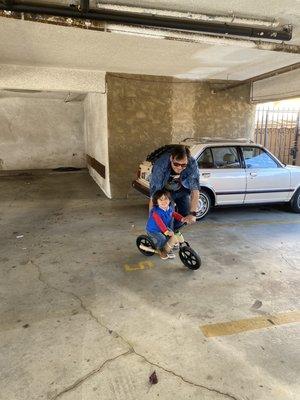 My son and husband on his Balance bike