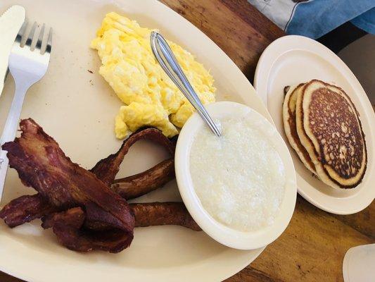 Grand Slam  Two pancakes  Bacon Sausage Grits Eggs