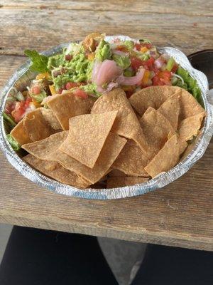 Chicken burrito bowl with lots of toppings including guacamole (big serving compared to most places). It's a lot of food!