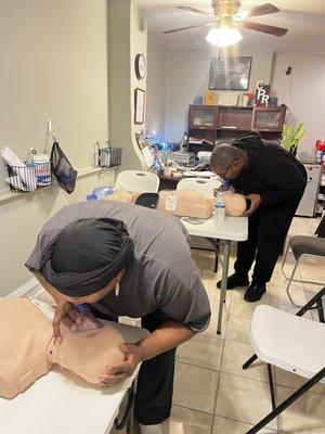 Single rescuer performing mouth to mouth, breathing technique with the actual lungs rising to simulate air getting into the lungs