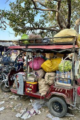 A flower, fruit, and veg market in the morning