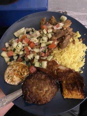 Shawarma, Israeli salad, hummus, yellow rice, and special for Chanukah potato latkes.