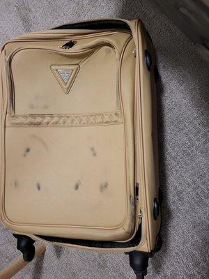 Suitcase was brand new , looks like tire marks over it, side is scraped off, zipper handles and locks torn off.