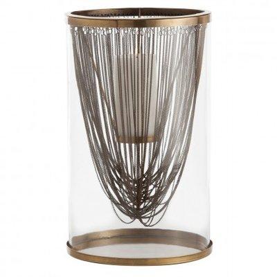 Worth Hurricane is a curtain of brass chainwork hanging inside a glass silo hurricane. Available at Arteriors Home.