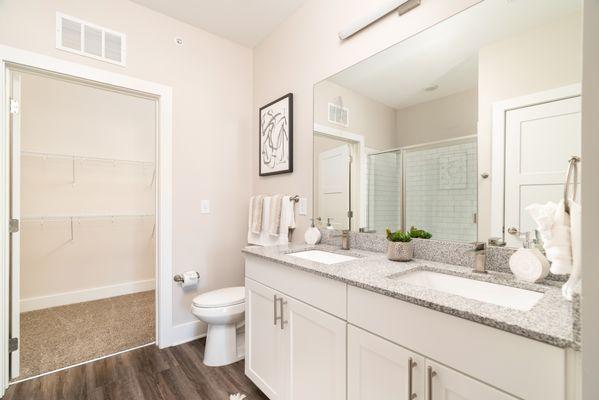 Master bath with double sink and walk-in shower.