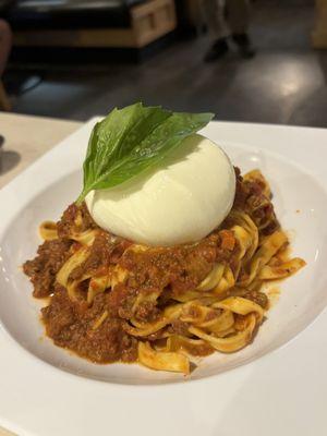 Made in house by the Chef. Spaghetti Bolognese with Barada on top.