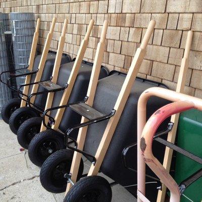 Wheel barrels lined up outside